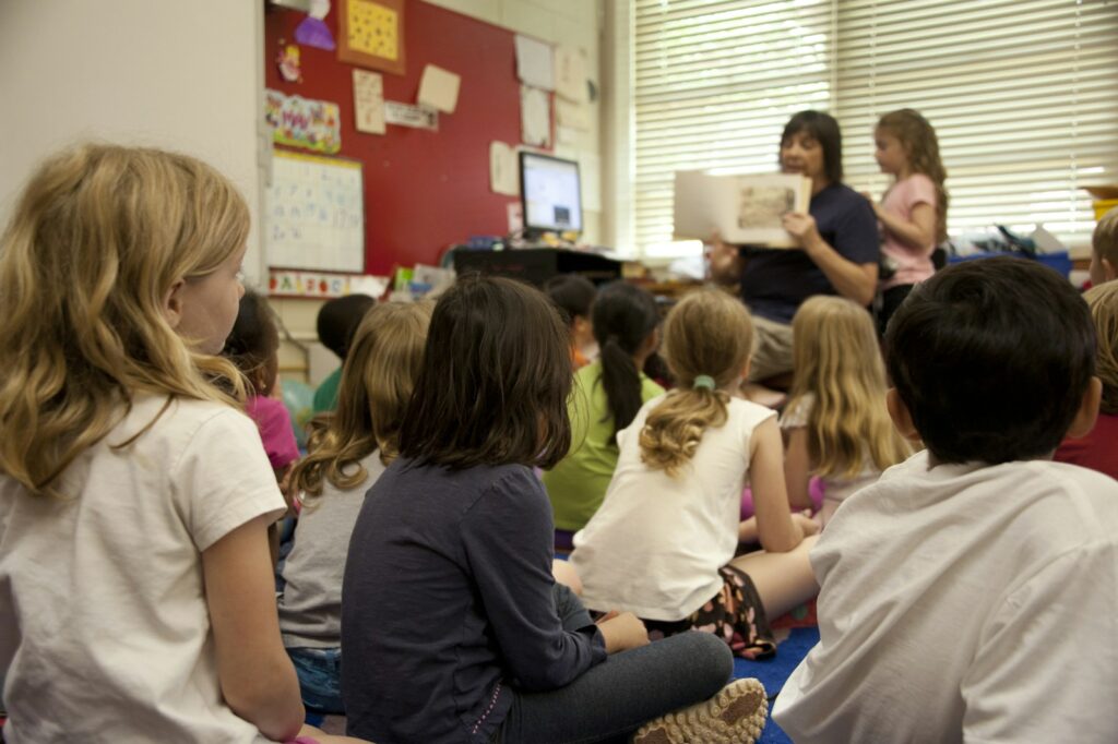 Students sitting on the carpet listening to a read-aloud